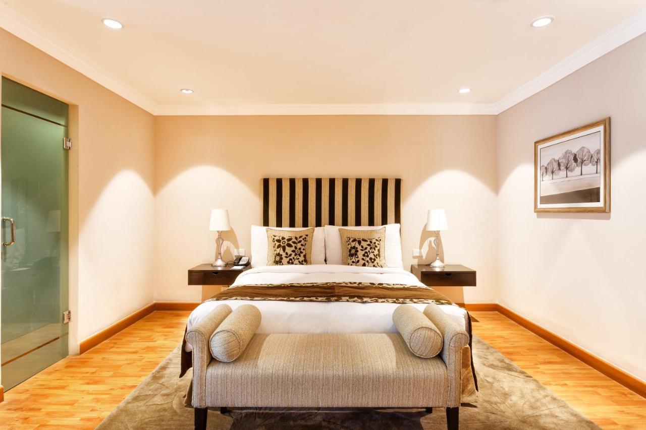 더 클라리지스 뉴 델리 뉴델리 외부 사진 A bedroom at the Taj Mahal Palace