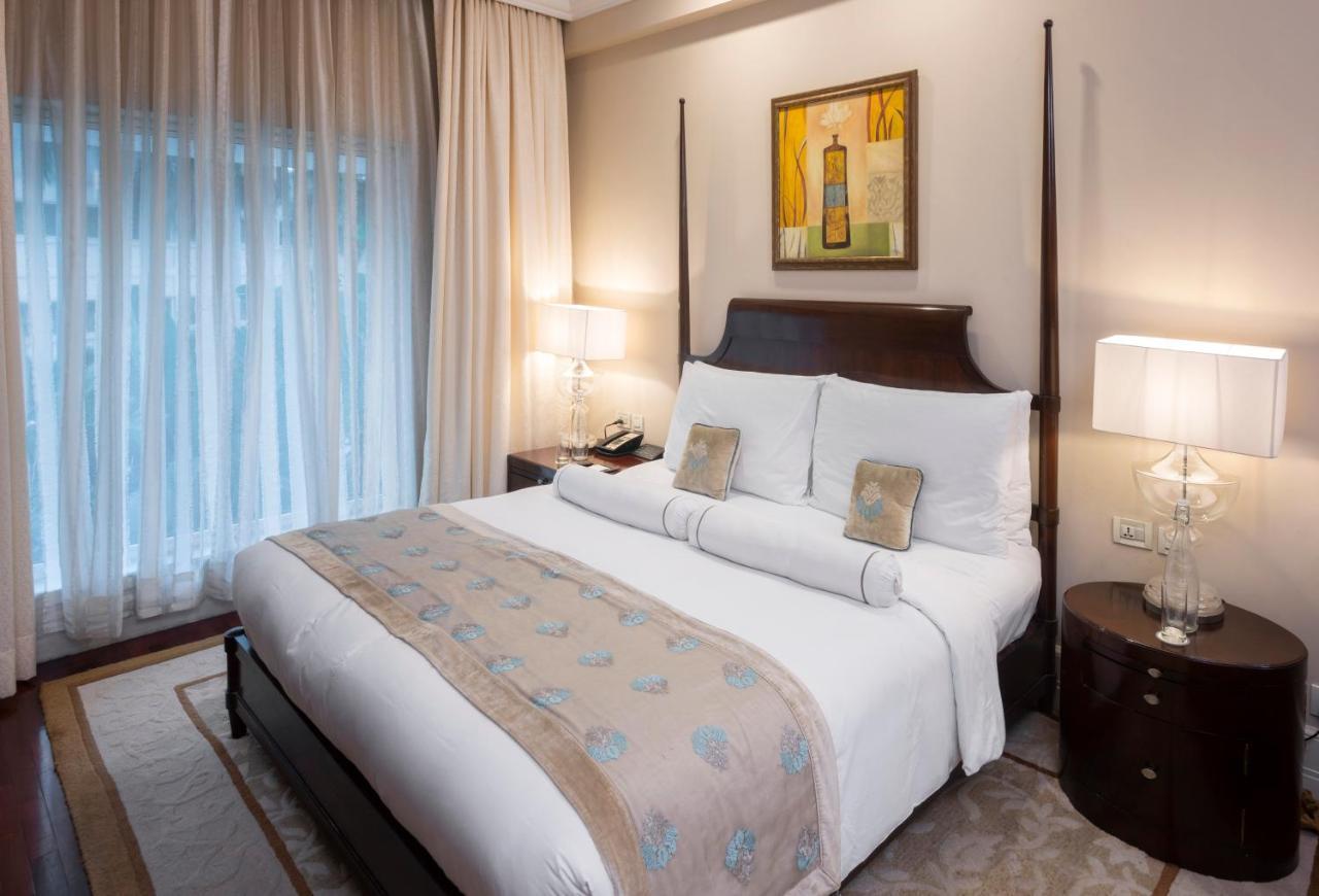 더 클라리지스 뉴 델리 뉴델리 외부 사진 A bedroom at the Taj Bengal