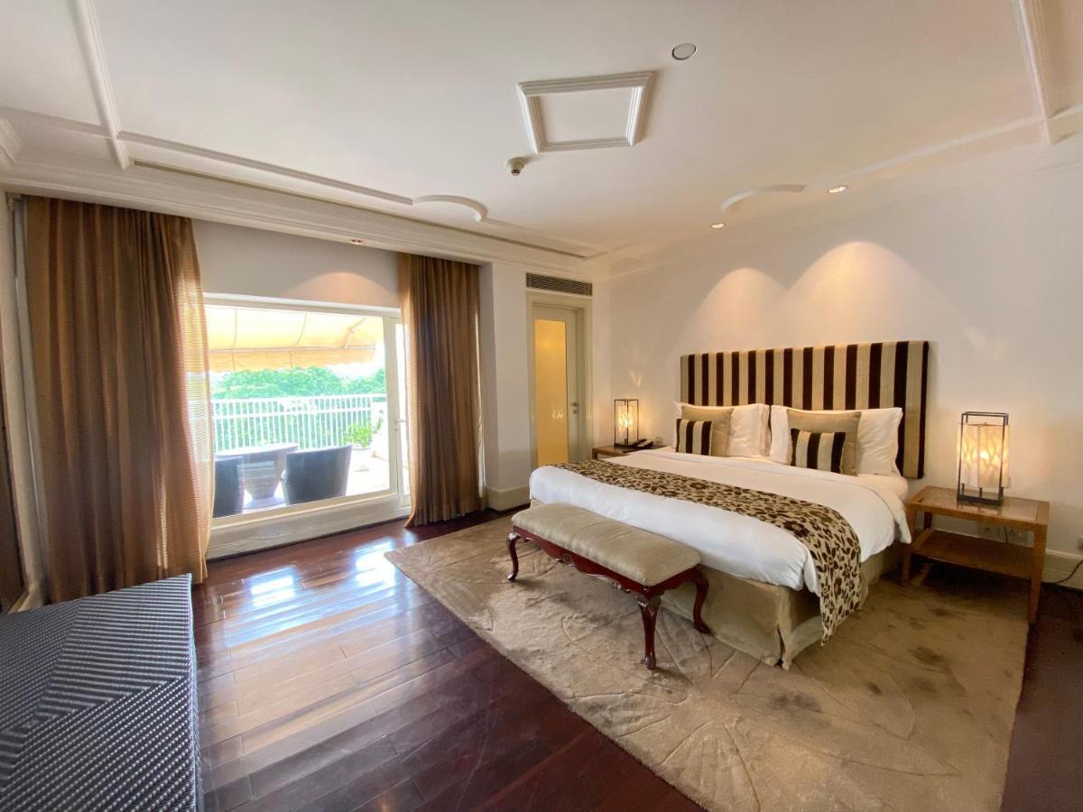 더 클라리지스 뉴 델리 뉴델리 외부 사진 A bedroom at the Taj Mahal Palace